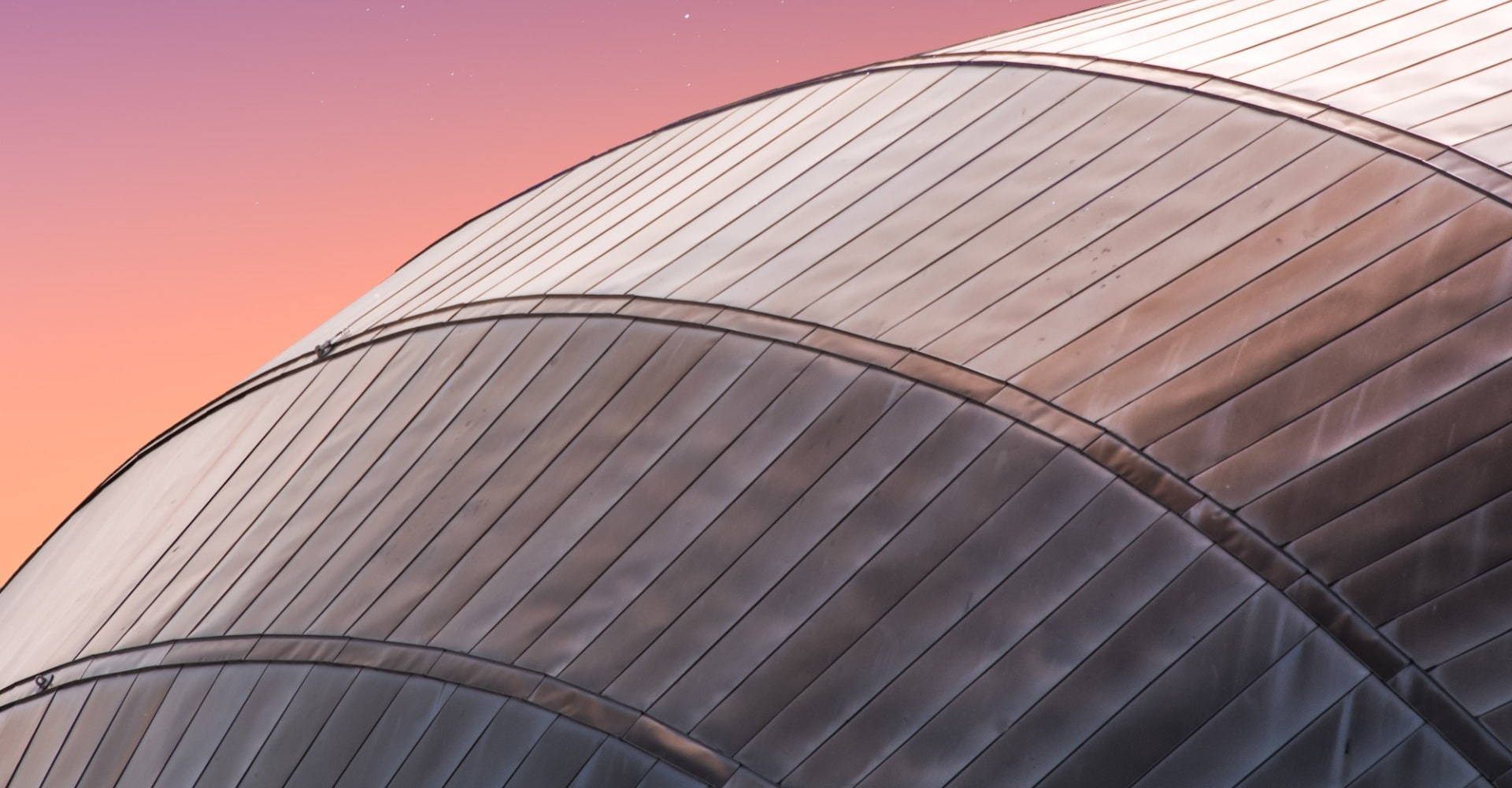 Pink sky with round building 