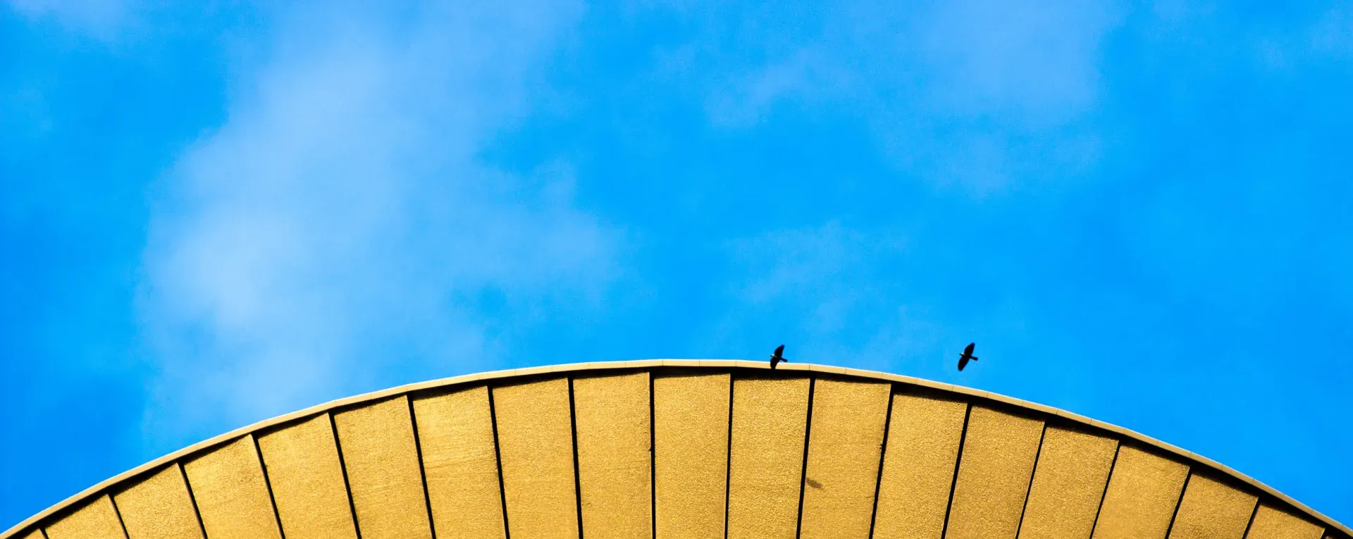 Round building and a blue sky